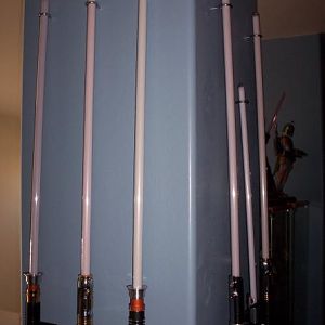 This is the 1st column of the loft, opposite side of the Vader entry. All known Master Replica FX sabers are present. The Darth Maul one is not visible.